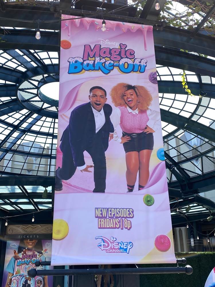 https://www.laughingplace.com/w/wp-content/uploads/2021/08/disneys-magic-bake-off-posters-and-photo-op-appears-at-downtown-disney-1.jpeg