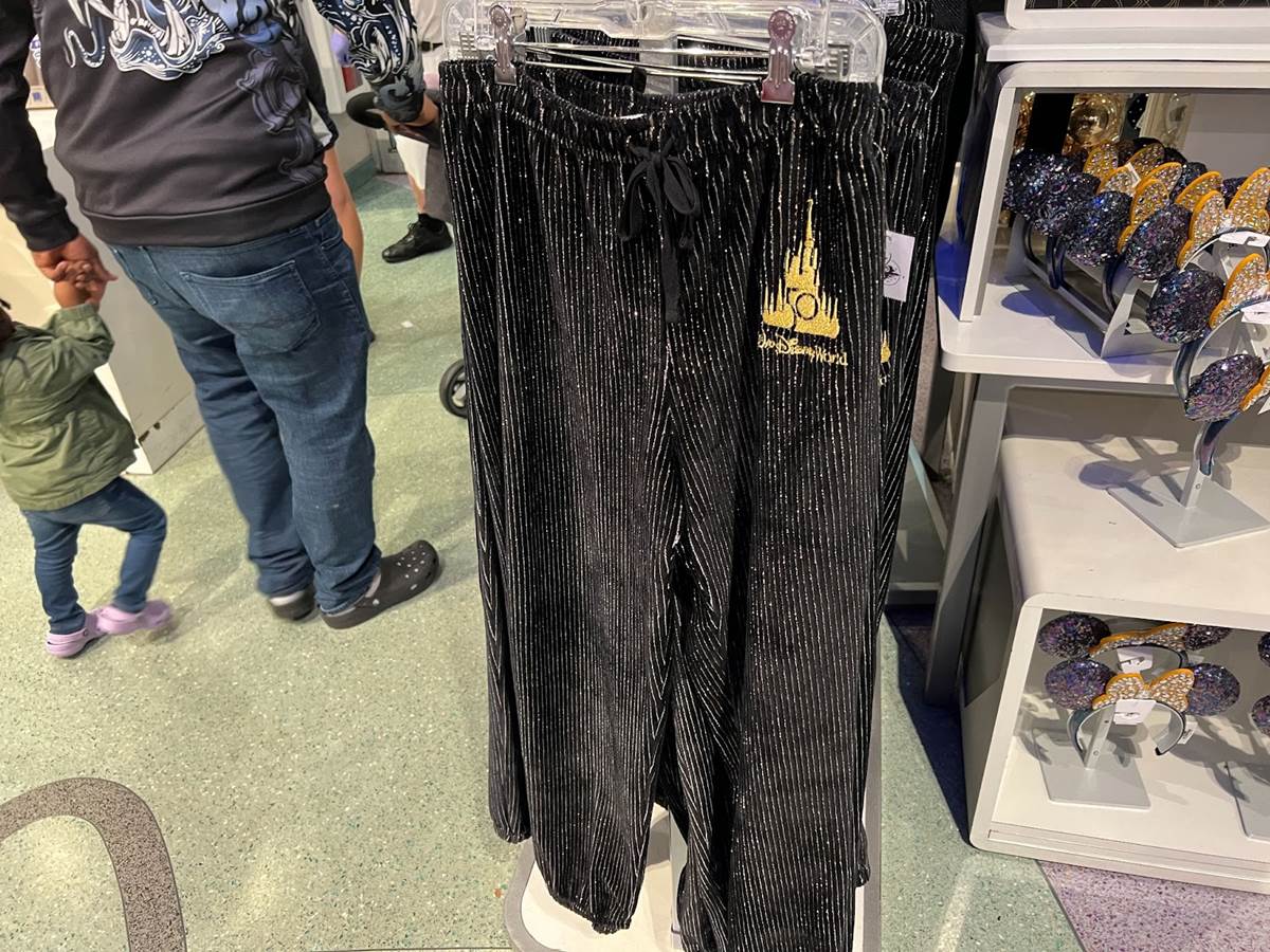 https://www.laughingplace.com/w/wp-content/uploads/2021/12/new-walt-disney-world-50th-anniversary-tracksuit-and-ears-hit-store-shelves-at-the-magic-kingdom-5.jpeg