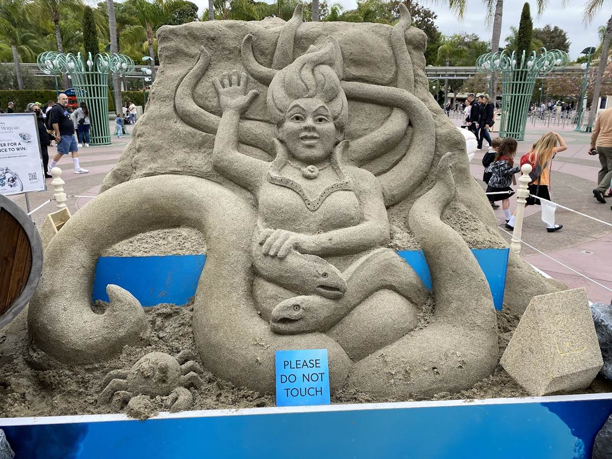 Sand sculpture of disney castle on miami beach on Craiyon