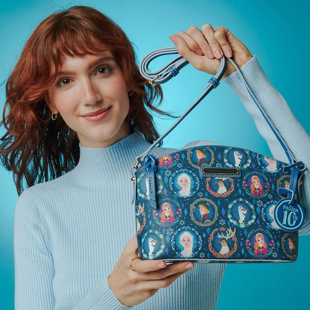 https://www.laughingplace.com/w/wp-content/uploads/2023/11/dooney-bourke-commemorates-10-years-of-frozen-with.jpeg