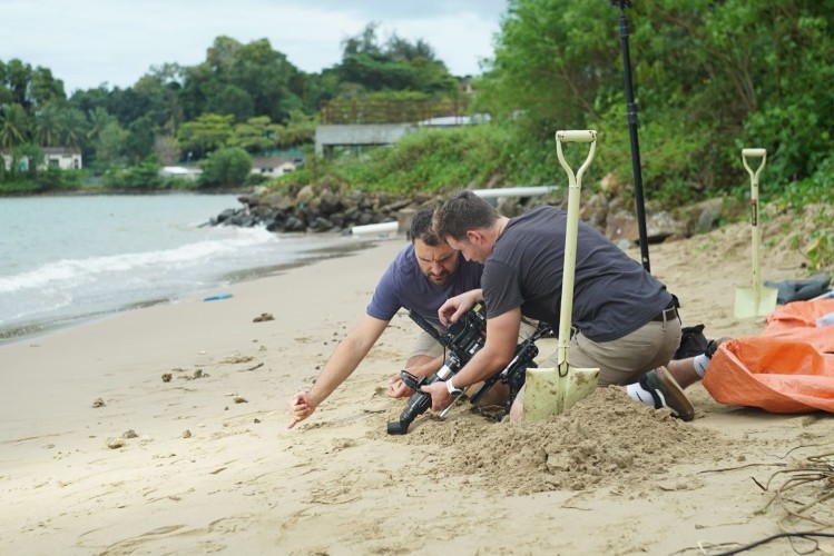 Camera assistant Nick Widdop and camera operator Dale Hudson film during a beach shoot in Kota Kinabalu, Borneo for the 'Life's A Beach' episode of 'A Real Bug's Life.'  (National Geographic/Euan Smith)